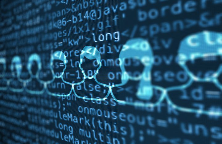 Computer data code screen with people icons